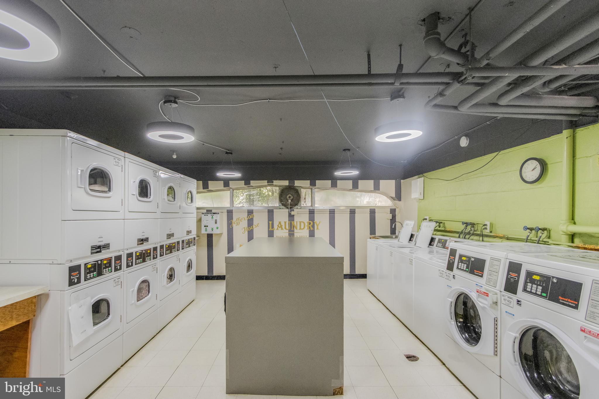 922 24th Street Northwest, Unit 415 Washington, DC 20037 - Photo 20 of 25 a kitchen with lot of cabinets and refrigerator