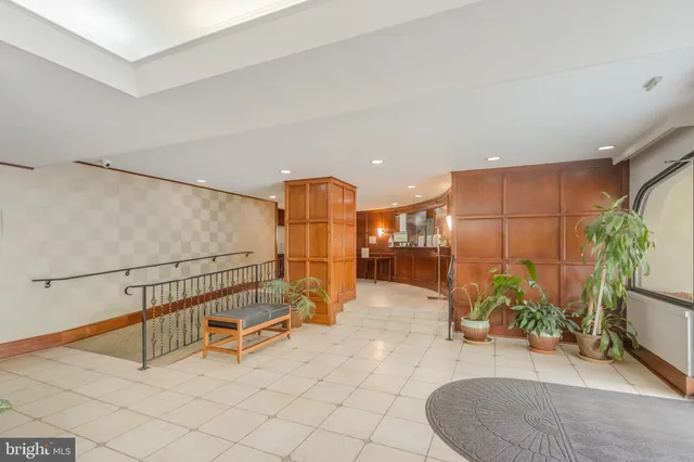 a lobby with furniture and window