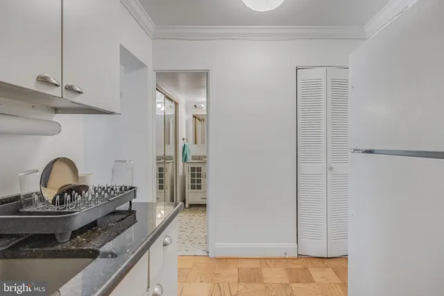 a kitchen with granite countertop a stove and a sink