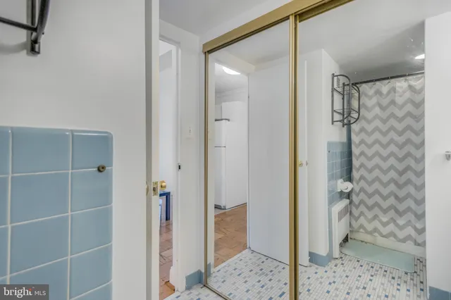 a bathroom with a glass door shower