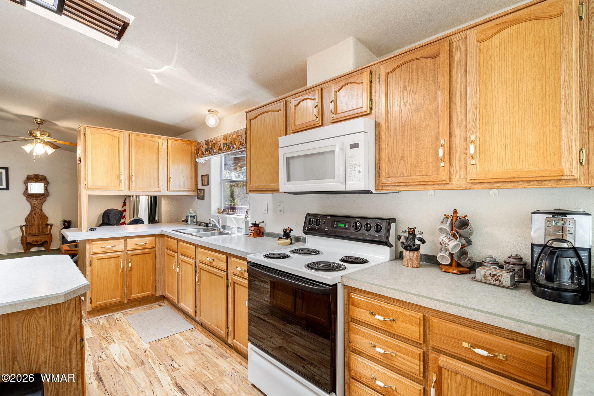 2908 Pine Rim Road Overgaard, AZ 85933 - Photo 11 of 34 a kitchen with a sink stove and cabinets
