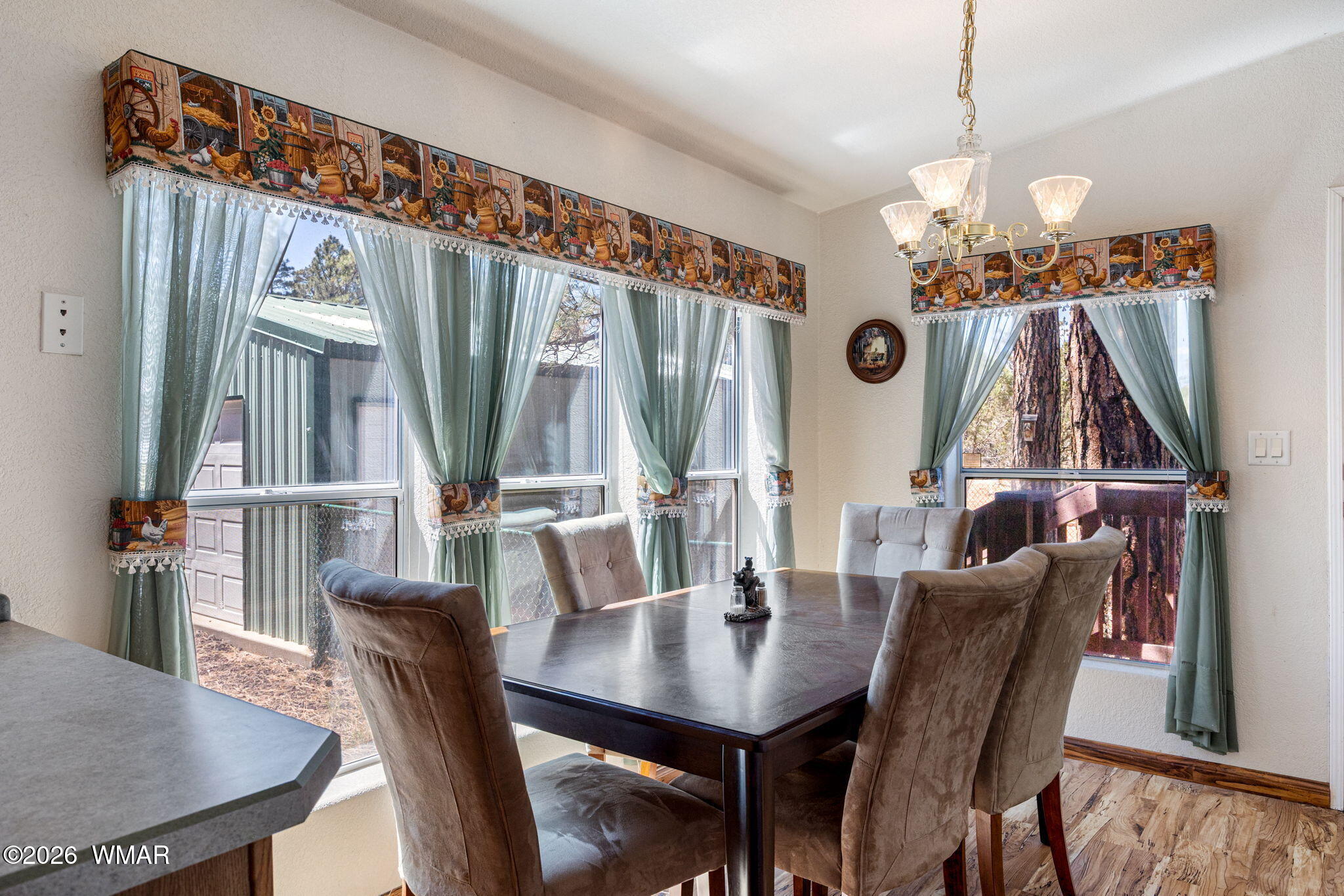 2908 Pine Rim Road Overgaard, AZ 85933 - Photo 13 of 34 a view of a dining room with furniture and wooden floor