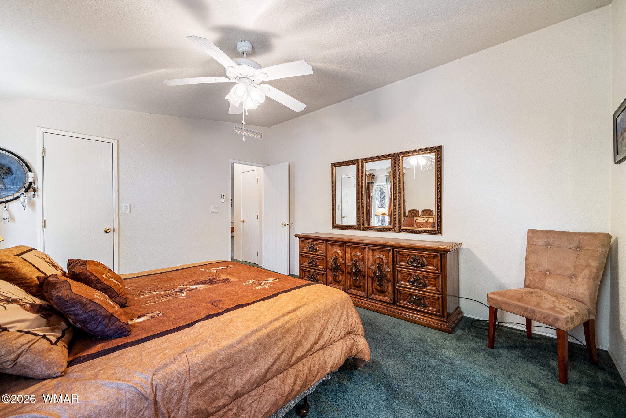 2908 Pine Rim Road Overgaard, AZ 85933 - Photo 15 of 34 a bedroom with a bed and a dresser