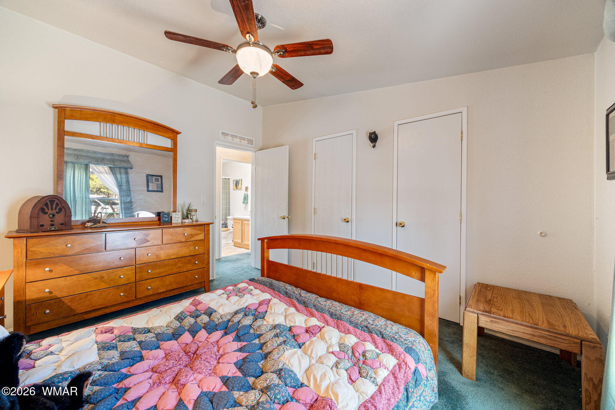 2908 Pine Rim Road Overgaard, AZ 85933 - Photo 19 of 34 a bedroom with bed and a dresser