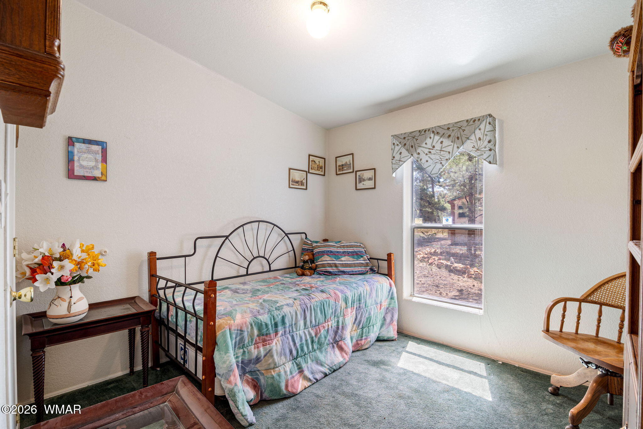 2908 Pine Rim Road Overgaard, AZ 85933 - Photo 21 of 34 a bedroom with furniture and a window