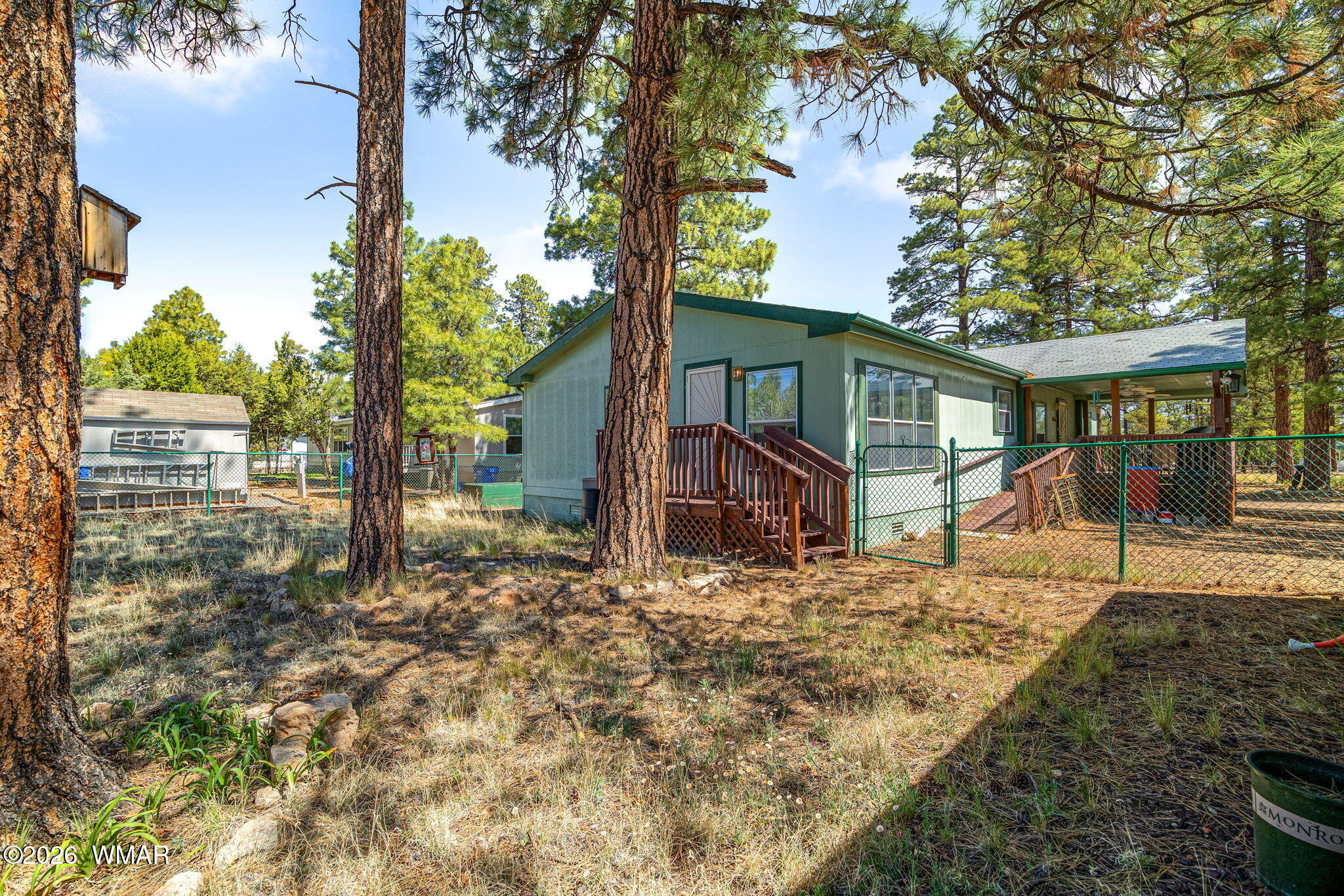 2908 Pine Rim Road Overgaard, AZ 85933 - Photo 25 of 34 a view of a house with a tree in the yard