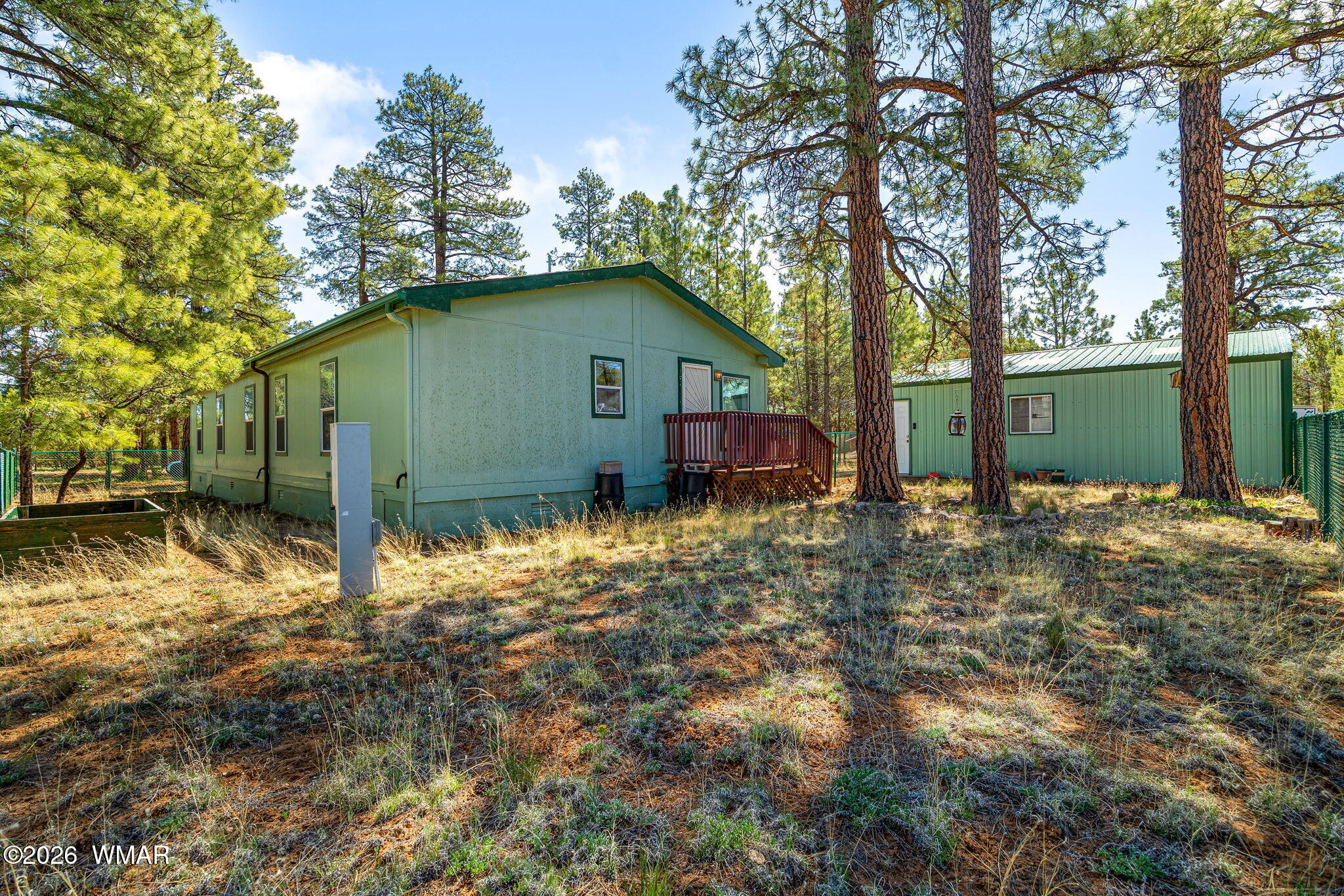 2908 Pine Rim Road Overgaard, AZ 85933 - Photo 26 of 34 a view of a house with a yard