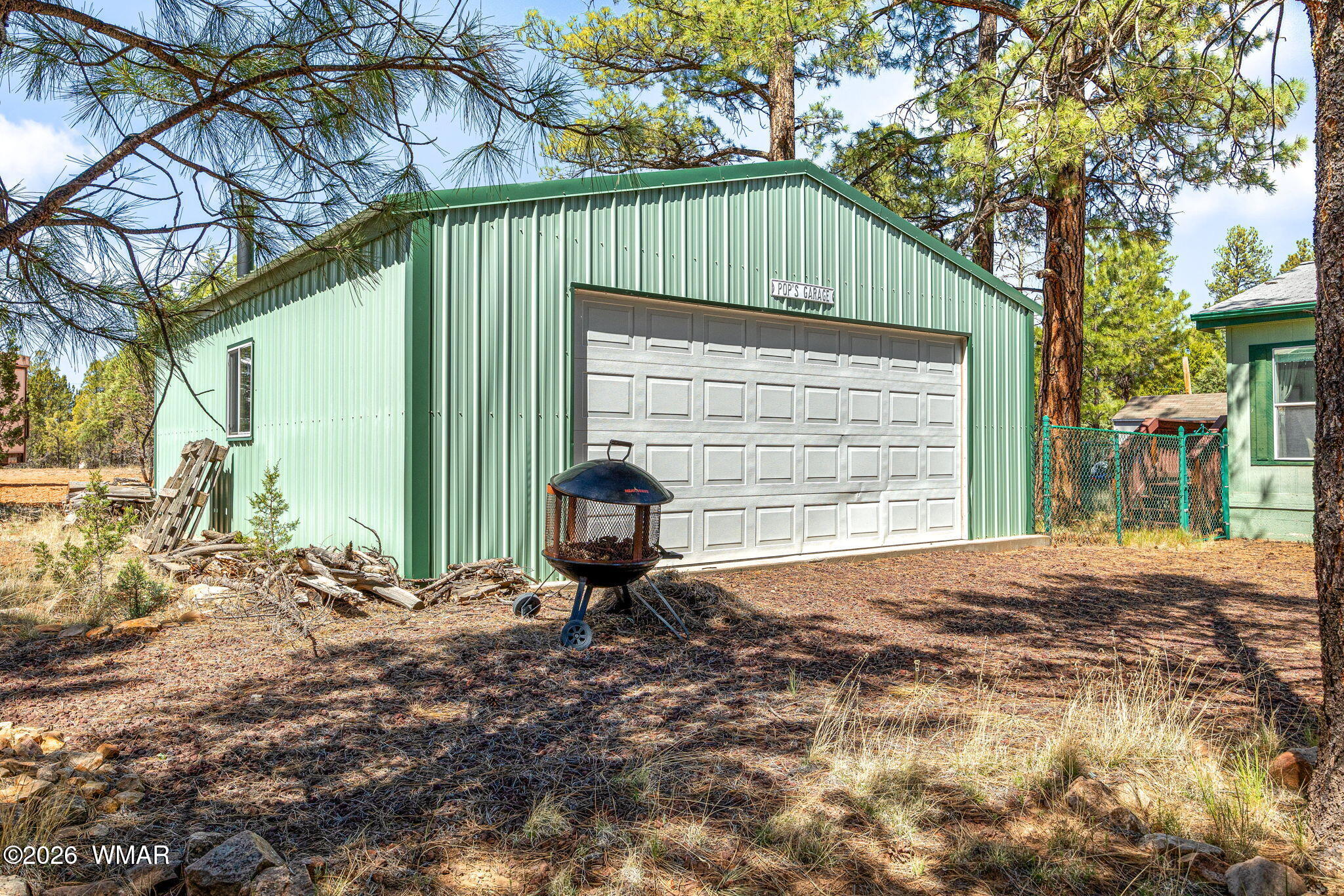 2908 Pine Rim Road Overgaard, AZ 85933 - Photo 27 of 34 a front view of a house with garden