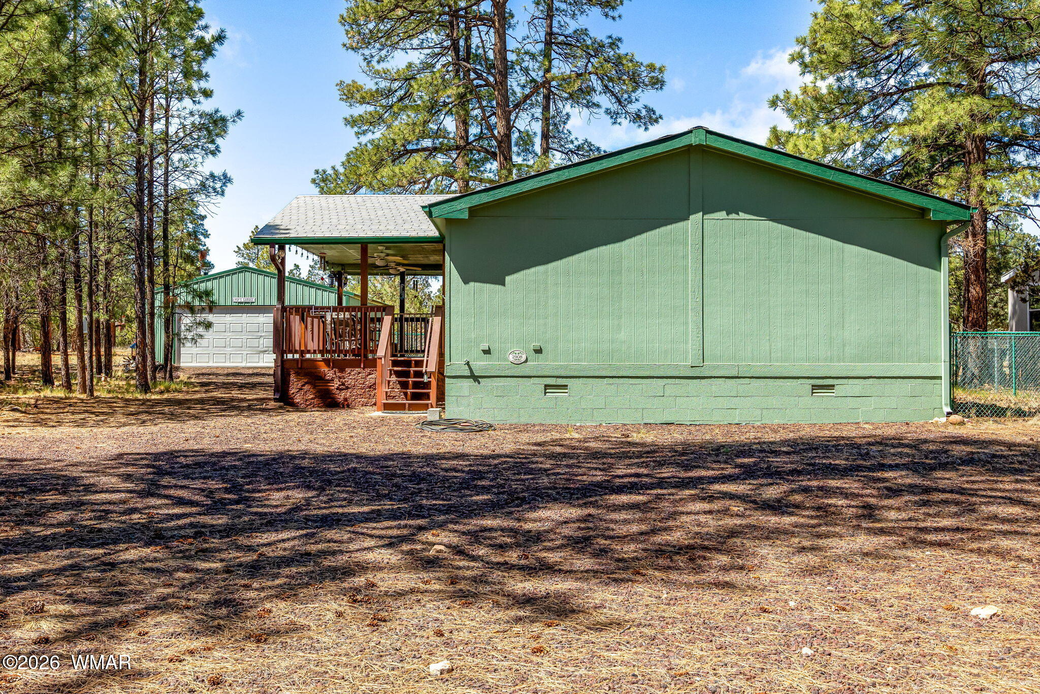 2908 Pine Rim Road Overgaard, AZ 85933 - Photo 5 of 34 a side view of a house with a yard
