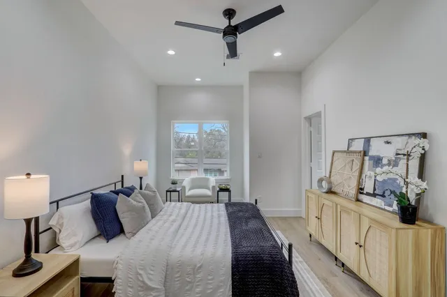 a bedroom with bed and window