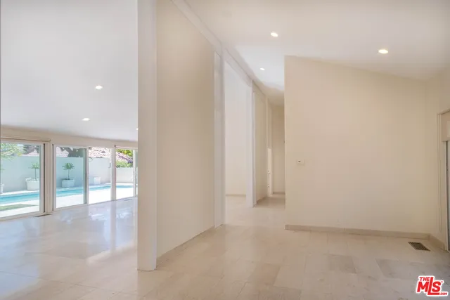 a bathroom with a granite countertop toilet and a sink