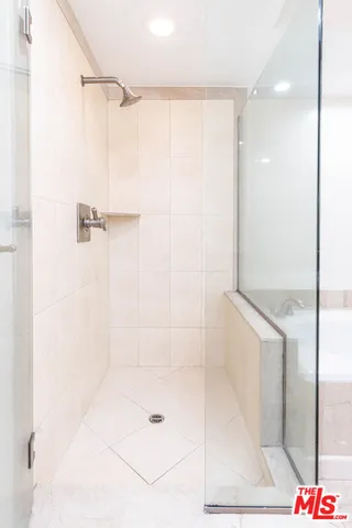 a view of a backyard with plants and swimming pool