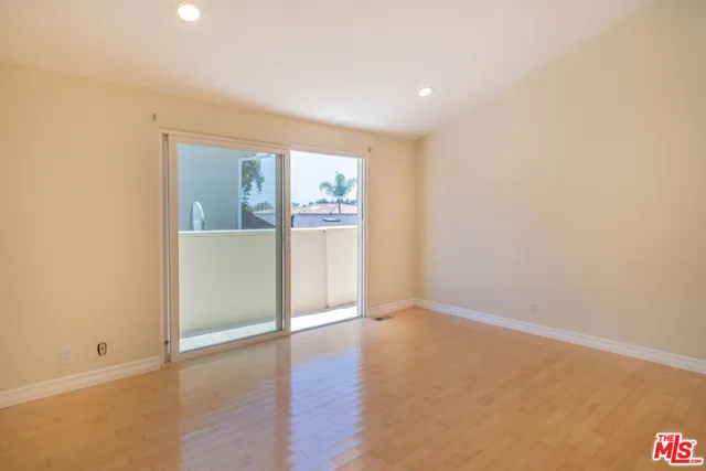 a bathroom with a granite countertop sink a toilet and bathtub