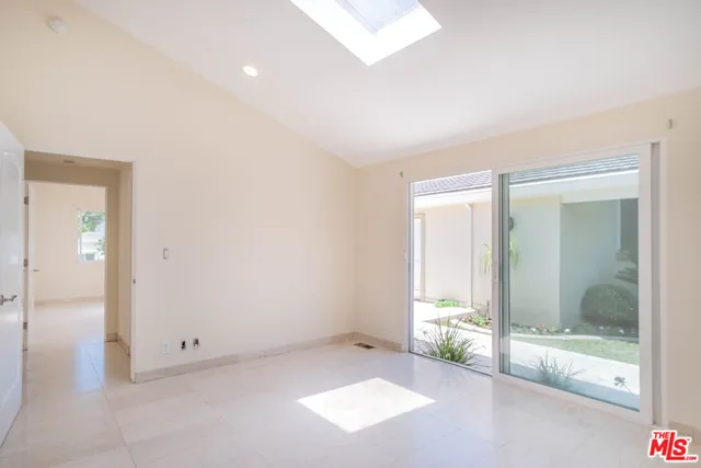 a bathroom with a granite countertop sink a toilet and bathtub