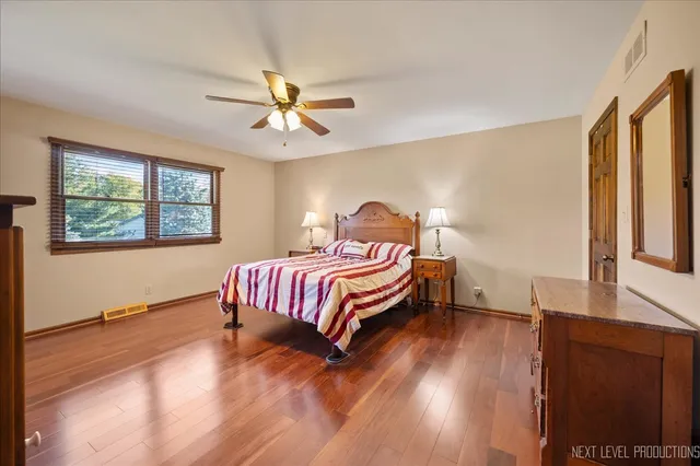 a bedroom with bed and a window