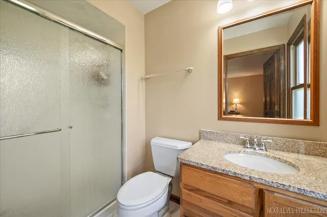 a bedroom with a large bed and a tv