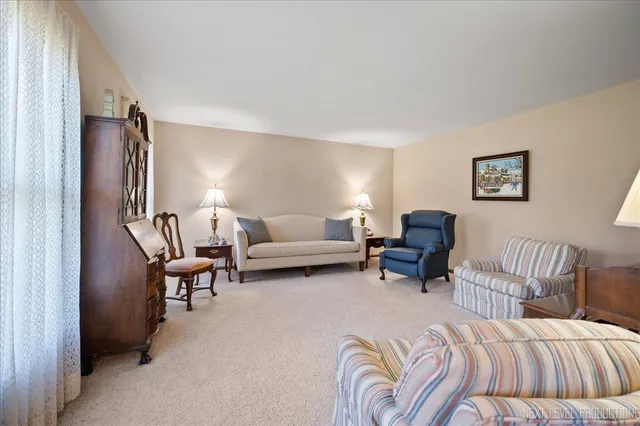 a view of a dining room with furniture and window