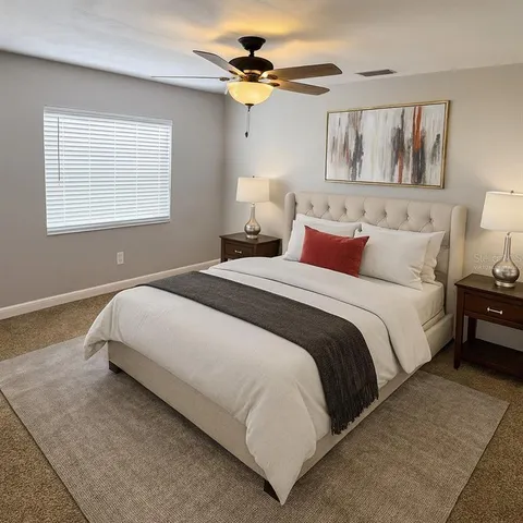 a view of a house with a yard and sitting area