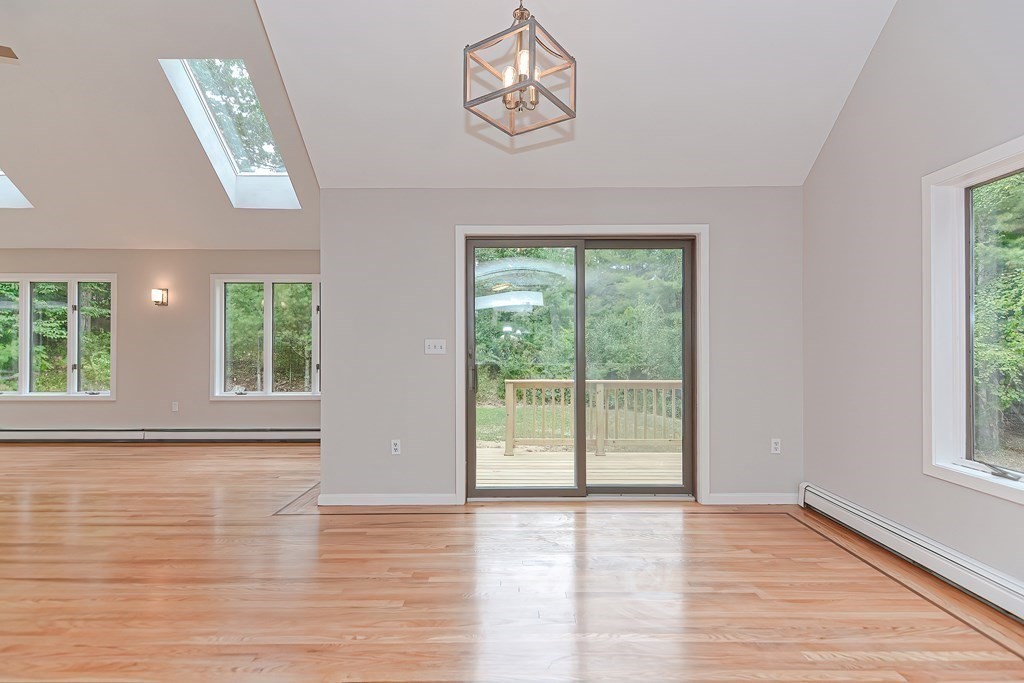 30 Lebel Road Rowley, MA 01969 - Photo 10 of 42 a view of an empty room with wooden floor and a window