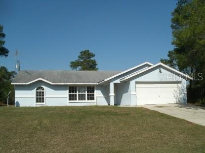 2817 Southwest 172nd Lane Road Ocala, FL 34473 - Photo 1 of 1 a big house with a big yard and large trees