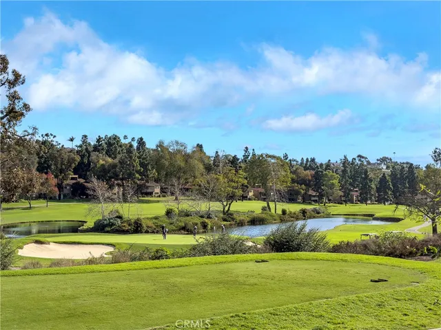 a view of a house with a yard and a garden