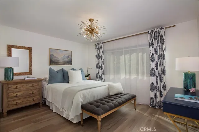 a bathroom with a toilet sink double vanity and mirror