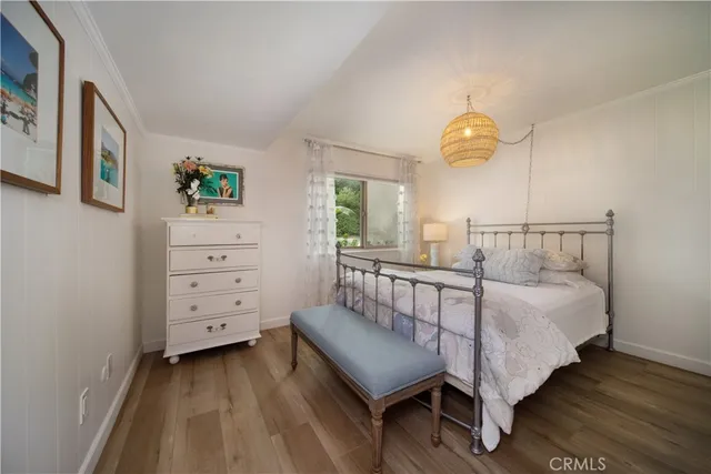 a spacious bathroom with a double vanity sink a toilet and a mirror