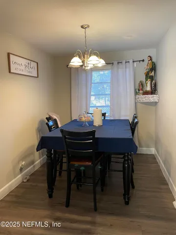 a kitchen with stainless steel appliances a refrigerator and a stove top oven