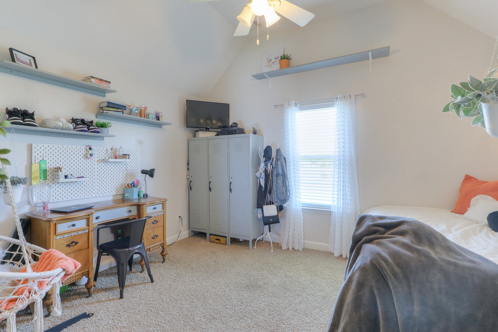 405 Burford Road Lebanon, TN 37087 - Photo 17 of 44 a bedroom with a bed and a chandelier