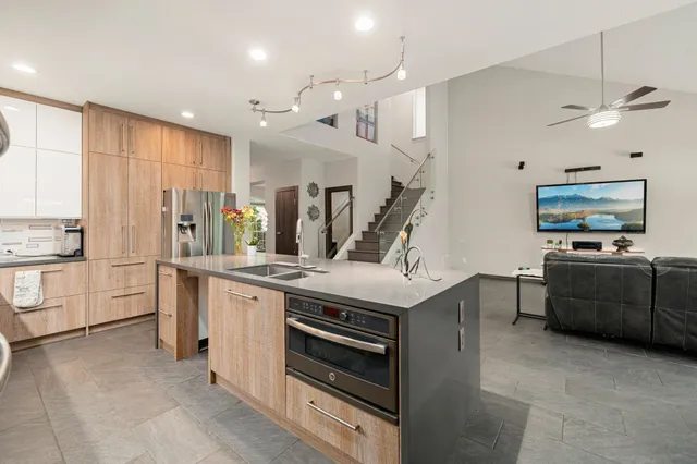 a kitchen with a stove and a refrigerator