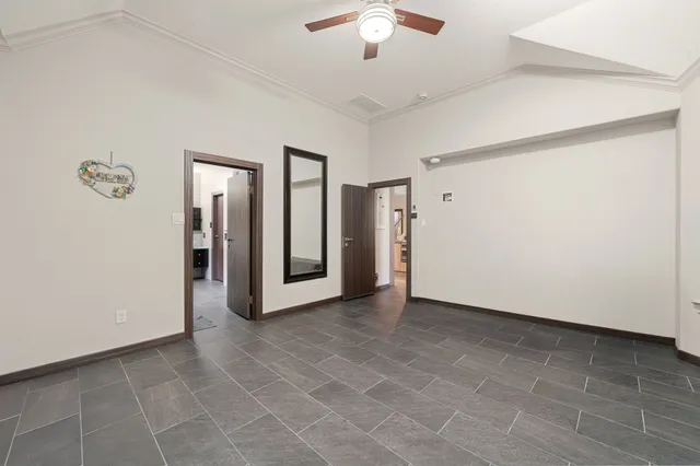 a view of an empty room with a bathroom