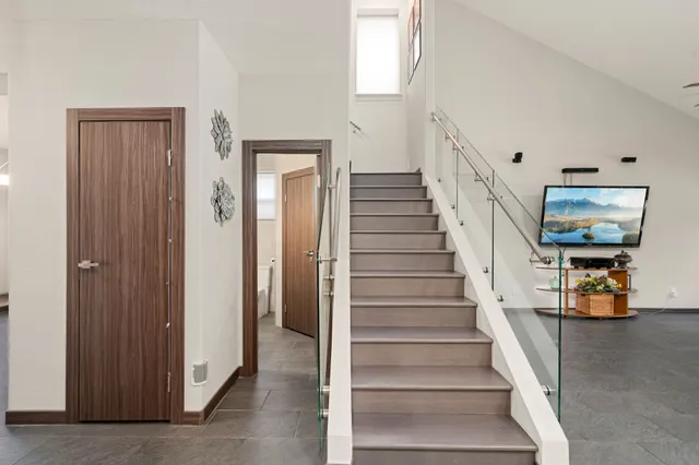 a view of entryway and hall with wooden floor
