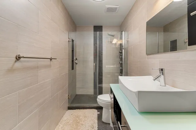 a bathroom with a sink and a large mirror