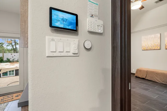 a view of a hallway with paintings on the wall