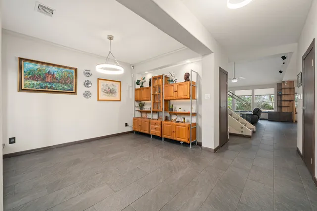 a view of a bedroom with window and furniture