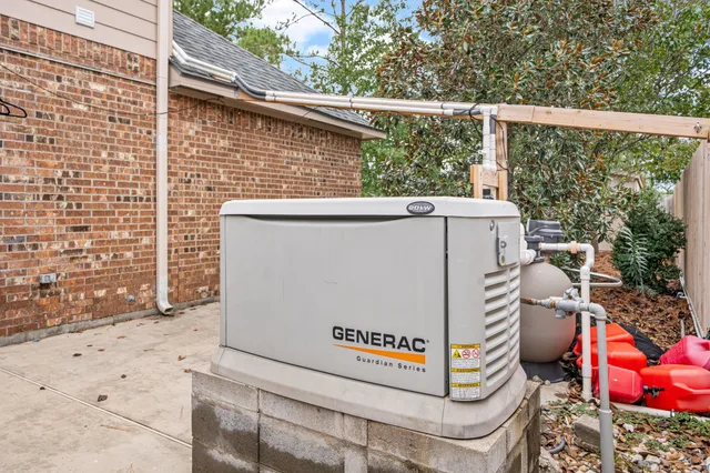 a view of a patio with table and chairs