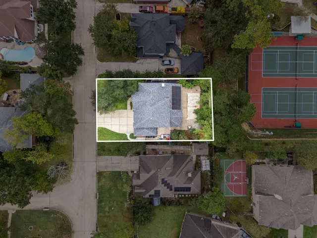 an aerial view of a house with outdoor space pool outdoor seating