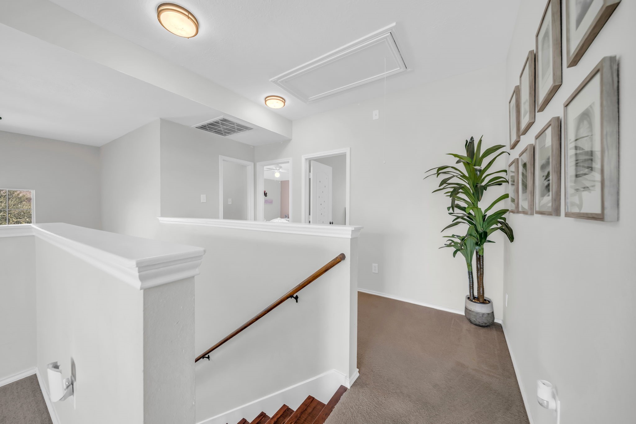 4502 Baron Road Baytown, TX 77521 - Photo 13 of 25 a view of entryway and hall with wooden floor