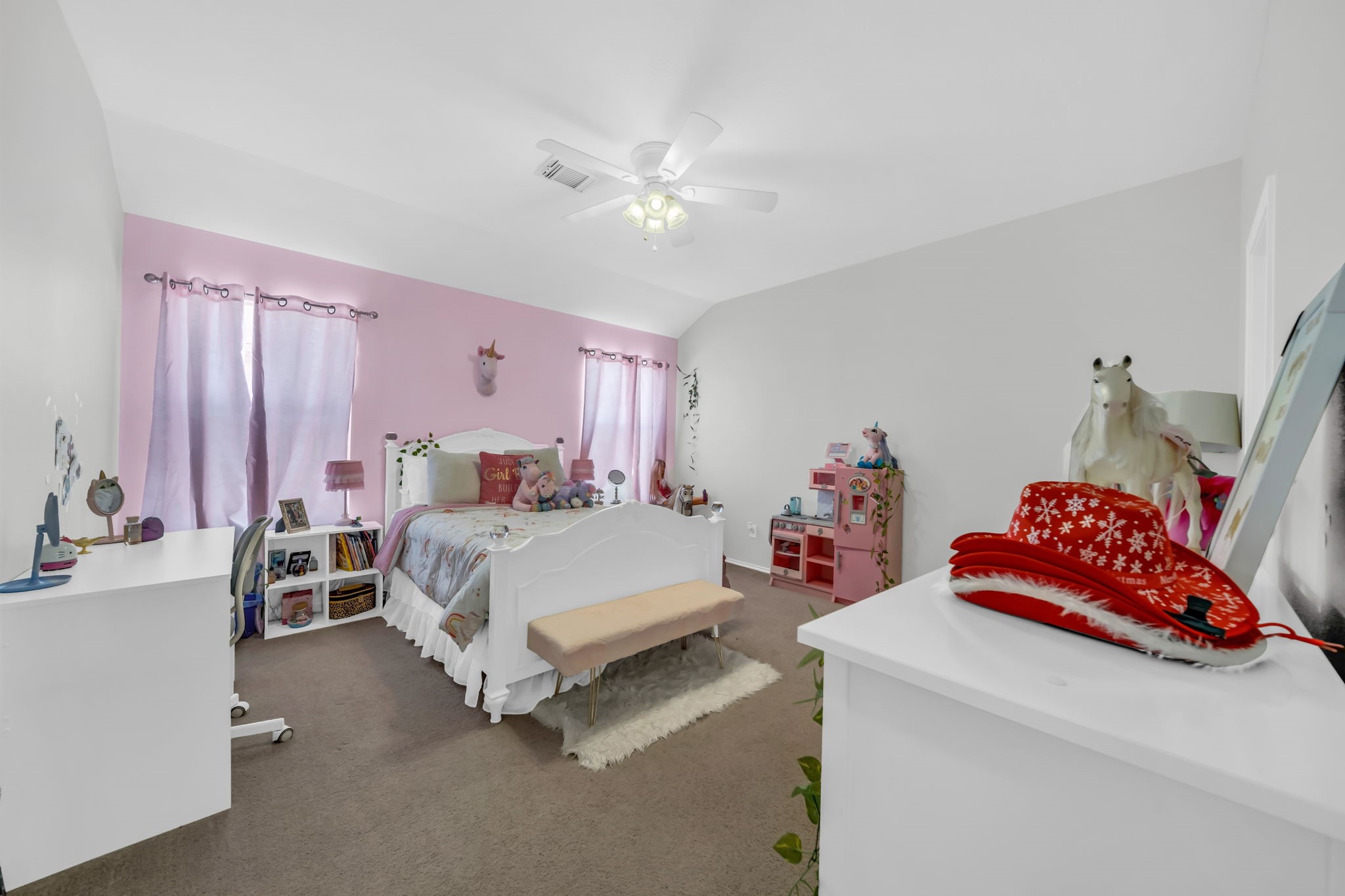 4502 Baron Road Baytown, TX 77521 - Photo 18 of 25 a bedroom with a bed and a chandelier