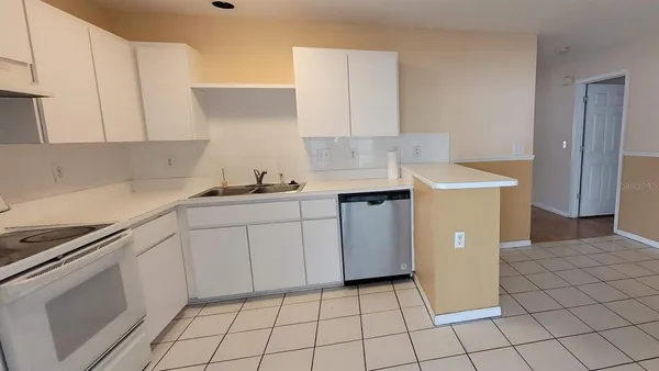 a kitchen with a sink and cabinets