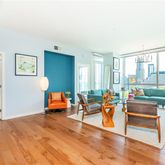 a living room with furniture and large windows