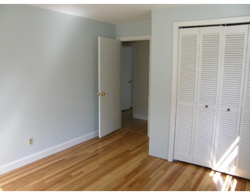 34 Webster Road Lexington, MA 02421 - Photo 7 of 12 a view of an empty room with wooden floor