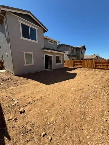 a house view with a outdoor space