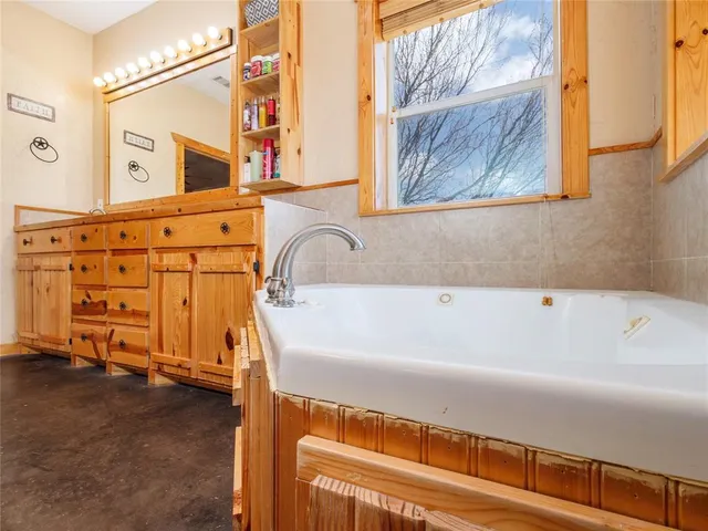 a bathroom with a bathtub and a sink