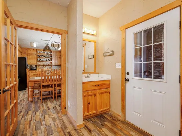 a view of a kitchen from the hallway