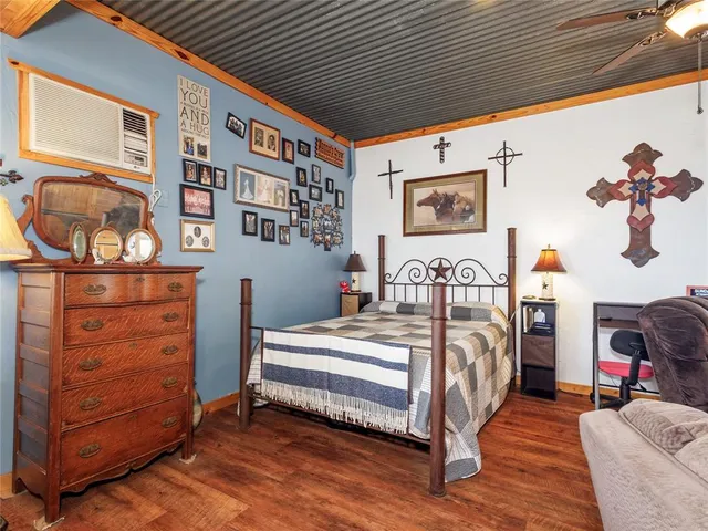 a bedroom with a bed and dresser