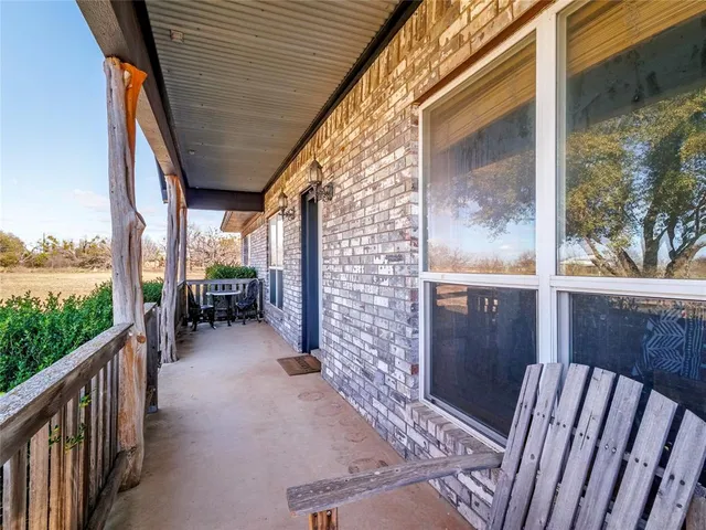 a view of balcony with furniture
