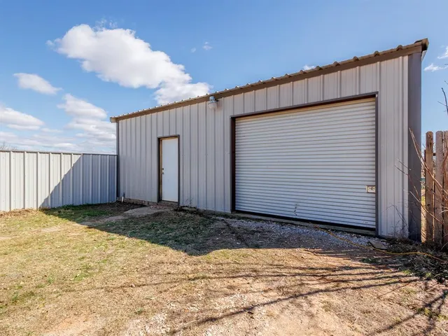 a view of a backyard of a house