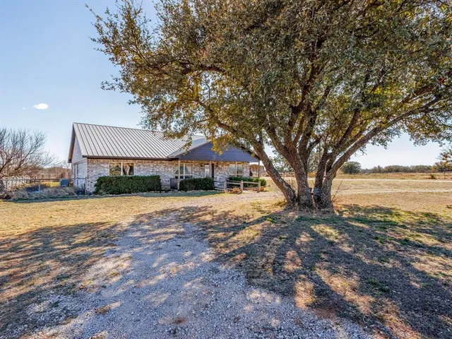 a house with trees in front of it