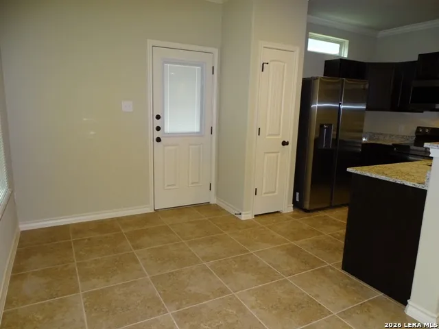 a kitchen with stainless steel appliances a sink and a stove